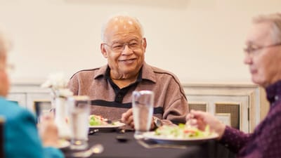 Residents enjoying a meal in the dining room