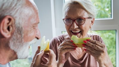 Happy seniors enjoying snacks together