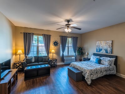 Cozy private resident room with bed and seating area