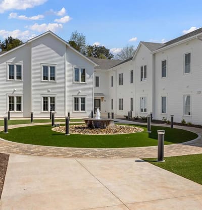 Outdoor courtyard with landscaping and a fountain
