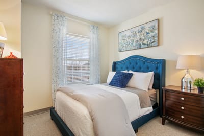 A well-furnished private resident room with decor