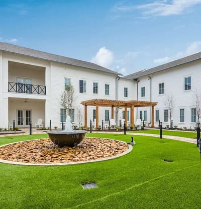 Beautiful landscaped courtyard with fountain and seating areas