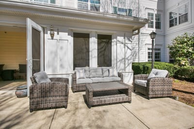 Patio seating area with furniture and greenery