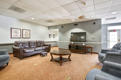 Cozy lounge area with seating and television
