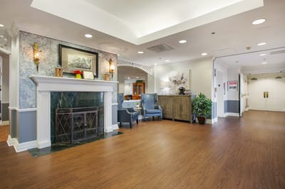 Bright and welcoming interior lobby with a fireplace