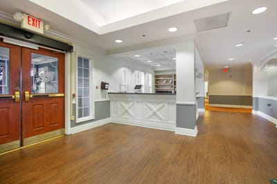 Interior view of a common area with an exit sign