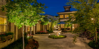 A serene outdoor garden area with a fountain
