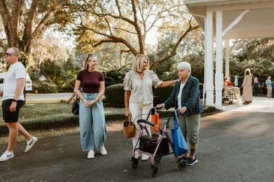 Residents and family enjoying a sunny outdoor event