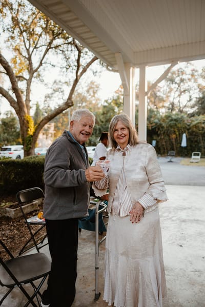 Residents toasting during an outdoor celebration