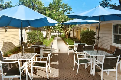 Outdoor seating area with umbrellas and tables