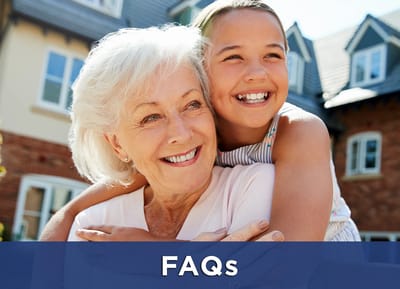 A smiling elderly woman and child enjoying time together