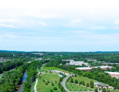 Aerial view of green space and buildings
