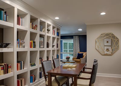 Interior common area with bookshelves and seating