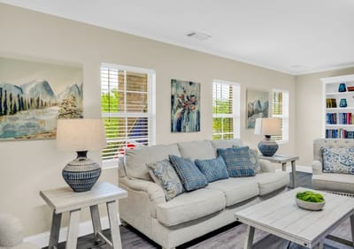 Bright living room with comfortable seating and artwork