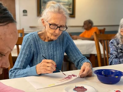 Resident engaged in painting activity