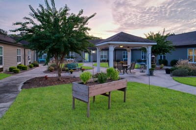 Well-maintained outdoor courtyard with seating and garden
