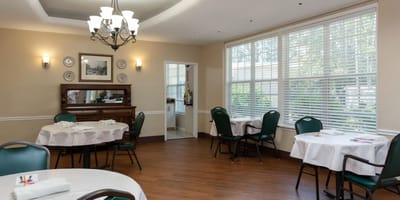 Bright dining room with tables and chairs