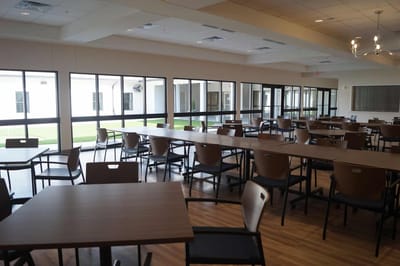 Spacious dining room with tables and chairs