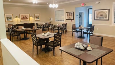 Dining room setup with tables and chairs