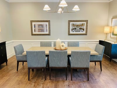Bright dining room with a large table and chairs