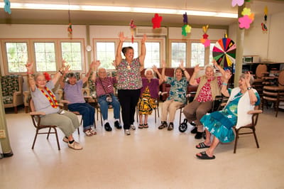 Residents participating in a lively group activity session