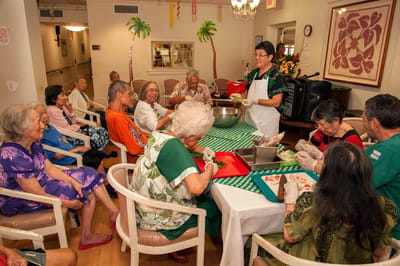Residents enjoying an activity together in the common area