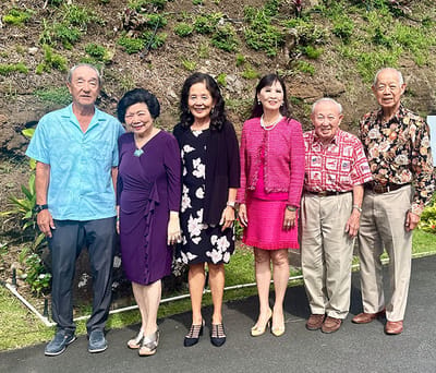 Group of residents posing together outdoors