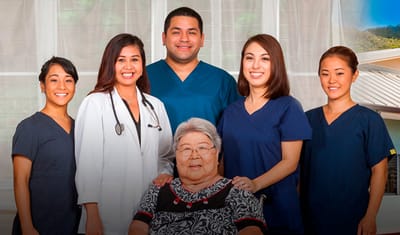 Staff with a resident smiling together.