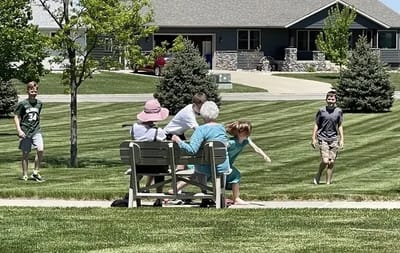 Residents and family enjoying time outdoors in the park