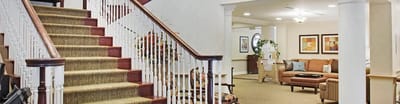 Interior lobby with a staircase and seating area