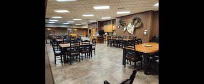 Interior view of a dining room with tables and chairs