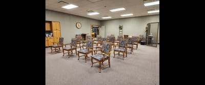 Empty chairs arranged in a meeting room