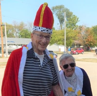Residents celebrating in festive costumes outdoors