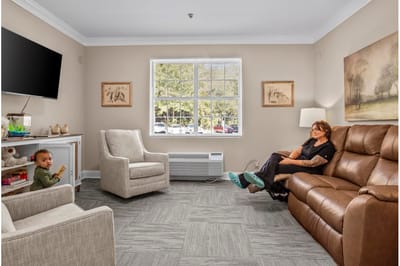 Cozy interior with a resident and child in a common area