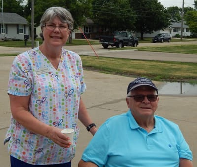 Staff member with a resident outdoors