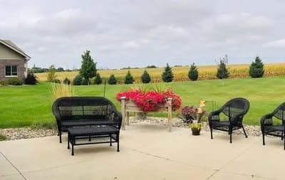 Outdoor seating area with a view of gardens