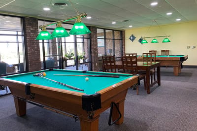 Interior view of a game room with pool tables