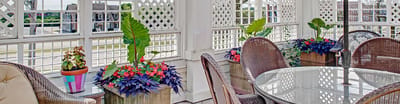 Bright common area with flowers and furniture