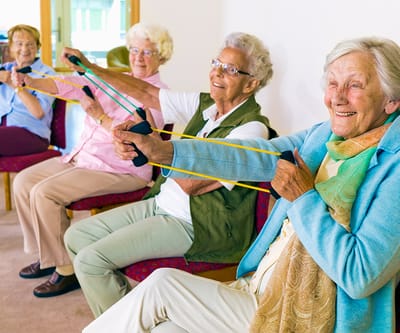 Residents participating in a group exercise activity
