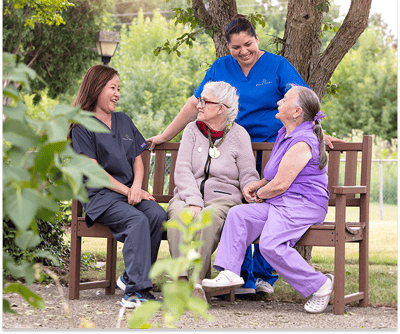 Residents and staff enjoying time outdoors together