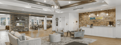 Bright common area with seating and dining