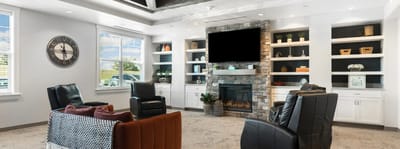 Bright common area with comfortable seating and fireplace