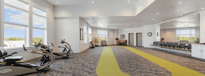 Interior view of a wellness activity room with exercise equipment