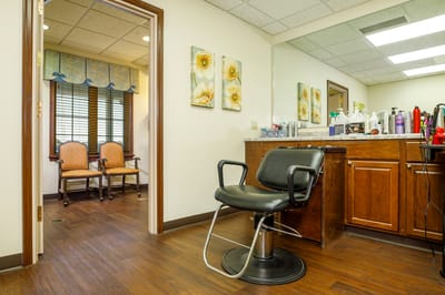 Interior of a beauty salon with a styling chair