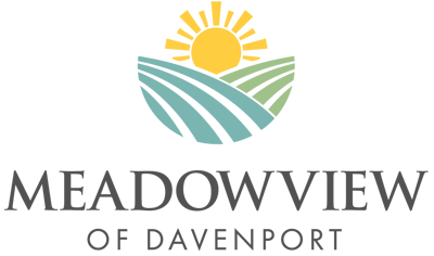 Facility logo featuring hills and sun