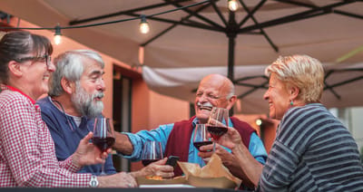 Residents enjoying drinks in an outdoor setting