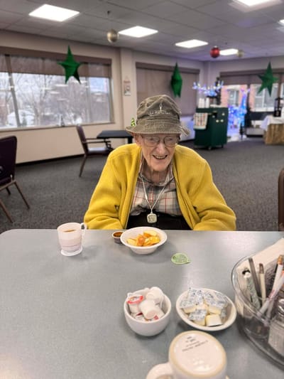 Resident enjoying a meal in a common area