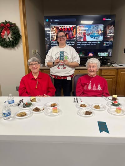 Residents enjoying dessert at a festive event