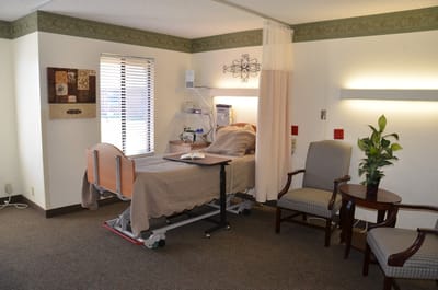Cozy resident room with bed and seating area