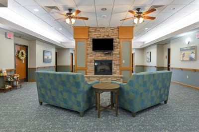 Common area with seating and fireplace